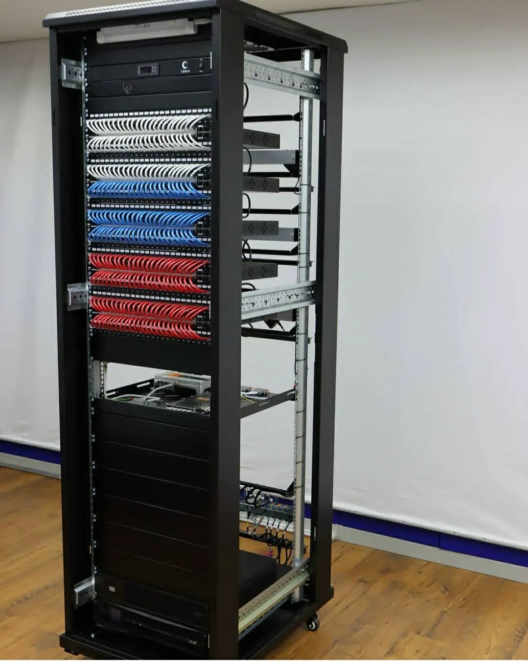 Dual server rack installation tempered glass front doors integrated cable channels thermal management secure equipment visibility Riyadh Saudi Arabia